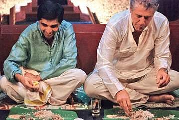 Anthony Bourdain enjoying local food during a visit to India