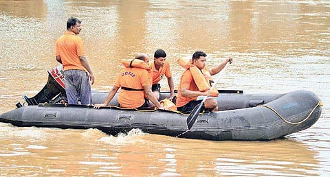 A school student being rescued by ODRAF and Fire brigade team in Kuakhai river on the outskirts of Bhubaneswar on Wednesday