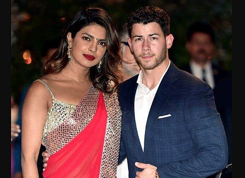 Priyanka Chopra and American singer-songwriter Nick Jonas arrive for Akash Ambani and Shloka Mehta's pre-engagement ceremony. (Photo | PTI)