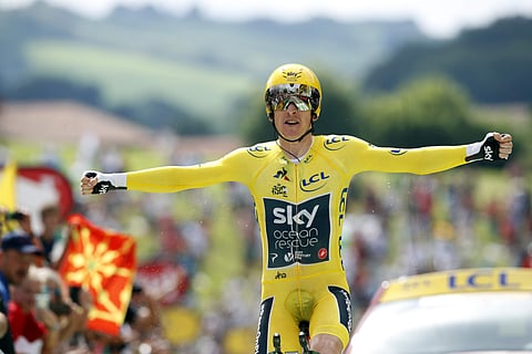 Britain's Geraint Thomas, wearing the overall leader's yellow jersey reacts as he crosses the finish line during the twentieth stage of the Tour de France cycling race, an individual time trial over 31 kilometers (19.3 miles) with start in Saint-Pee-sur-N