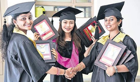 Toppers Amrutha B V, Lalremsiami and Manjushree of Ambedkar Institute celebrate their graduation day on Saturday | Vinod Kumar T