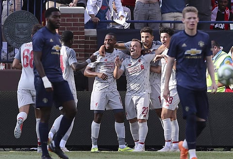 Liverpool midfielder Xherdan Shaqiri (23) celebrates his goal with teammates during the second half of an International Champions Cup tournament soccer match against Manchester United. | AP