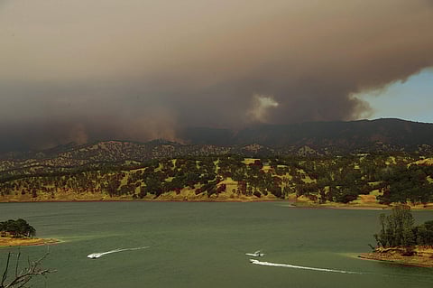 A massive wildfire in rural Northern California has exploded in size and forced evacuations in hot, dry weather that is sweeping through several western states where blazes are threatening thousands of homes. (Photo | AP)