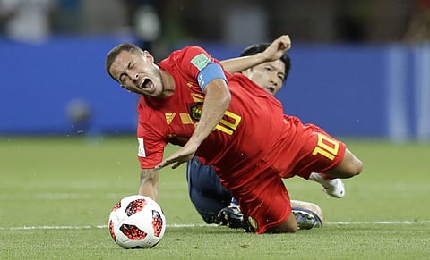 Belgium's Eden Hazard is fouled by Japan's Gaku Shibasaki during the round of 16 match between Belgium and Japan at the 2018 soccer World Cup in the Rostov Arena, in Rostov-on-Don, Russia, July 2, 2018. (Photo | AP)