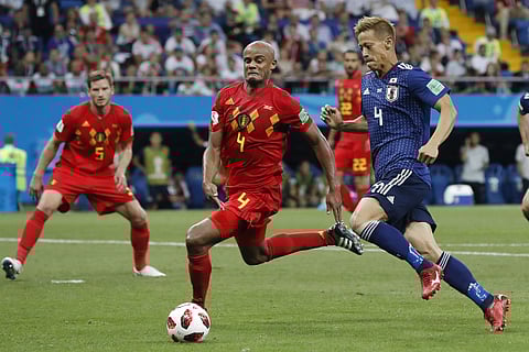 Japan's Keisuke Honda, right, and Belgium's Vincent Kompany go for the ball during their round of 16 match at the 2018 soccer World Cup in the Rostov Arena, in Rostov-on-Don, Russia, Monday, July 2, 2018. | AP