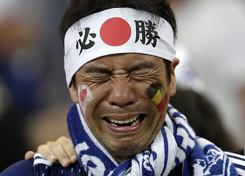 A Japan supporter cries after losing the round of 16 match between Belgium and Japan at the 2018 FIFA World Cup in the Rostov Arena, Russia, July 2, 2018. (Photo | AP)