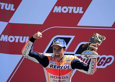 Spain's rider Marc Marquez of the Repsol Honda Team celebrates on the podium after winning the MotoGP race during the Dutch Grand Prix in Assen, northern Netherlands. | AP