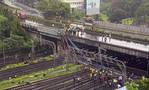 Mumbai Rescue workers underway after a foot-overbridge collapsed on the railway tracks following heavy rains at Andheri Station in Mumbai on Tuesday July 3 2018. | PTI