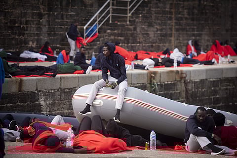 In this photo taken on Friday, July 27, 2018, migrants rest at the port of Tarifa, southern Spain, as they wait to be moved after being rescued by Spain's Maritime Rescue Service in the Strait of Gibraltar, in Tarifa, Spain. (Photo | AP)