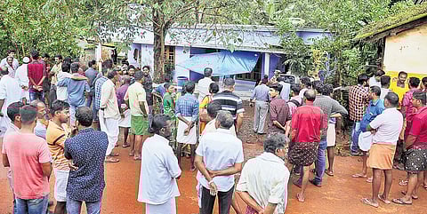 Local residents gather in front of Nimisha’s house after hearing about her brutal murder on Monday | A Sanesh