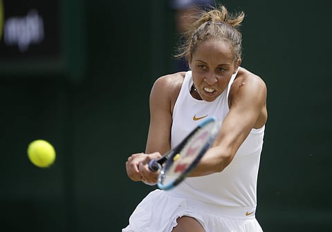 Madison Keys of the US returns the ball to Luksika Kumkhum of Thailand during their women's singles match on the third day at the Wimbledon Tennis Championships. (Photo | AP)
