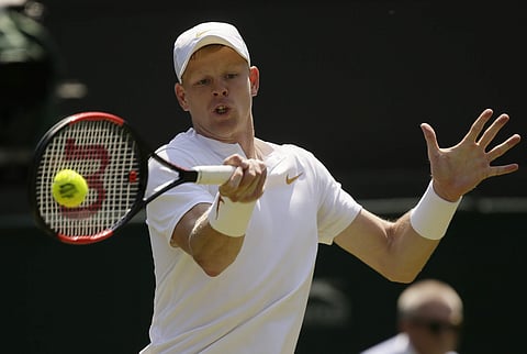 Kyle Edmund plays a ball to Alex Bolt during their men's singles match on the second day at the Wimbledon Tennis Championships in London. | AP