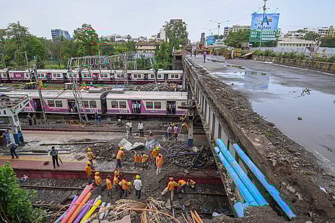Workers carry out repair work of Gokhale foot overbridge that collapsed on the Western Railway tracks on June 03, 2018, at Andheri station following heavy rains, in Mumbai on Wednesday, July 04, 2018. (Photo | PTI)