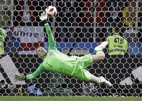 England goalkeeper Jordan Pickford saves a penalty during the round of 16 match between Colombia and England at the 2018 soccer World Cup in the Spartak Stadium, in Moscow. (AP)