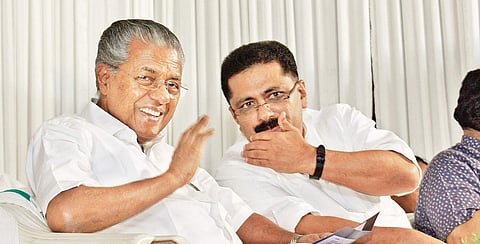 Chief Minister Pinarayi Vijayan chats with Cabinet colleague K T Jaleel in Kozhikode. (File | EPS/Manu R Mavelil)