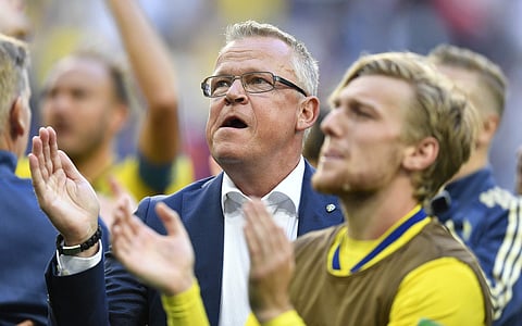 Sweden coach Janne Andersson celebrates with teammates after winning the round of 16 match against Switzerland at the 2018 soccer World Cup in the St. Petersburg Stadium. | AP
