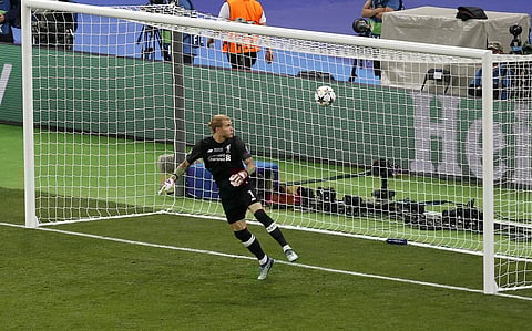 Liverpool goalkeeper Loris Karius looks at the ball after Real Madrid's Gareth Bale scored his side's 3rd goal during the Champions League Final soccer match between Real Madrid and Liverpool at the Olimpiyskiy Stadium in Kiev, Ukraine, Saturday, May 26, 