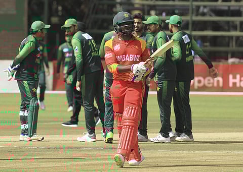 Zimbabwean batsman Solomon Mire walks off the pitch dismissed during the T20 cricket match against Pakistan at Harare Sports Club, in Harare, Zimbabwe, Wednesday, July, 4, 2018. Zimbabwe is playing host to a tri-nation Twenty20 International series with A
