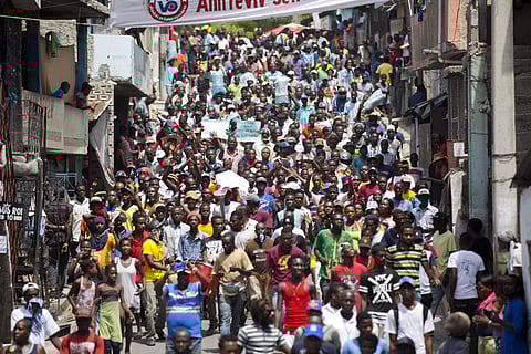 Demonstrators march during a protest against government tax hikes, in Port-au-Prince, Haiti, Thursday Sept. 28, 2017. | AP