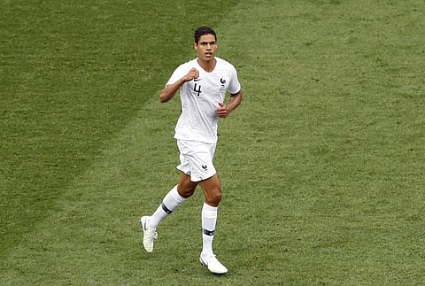 France's Raphael Varane celebrates after scoring the opening goal during the quarterfinal match between Uruguay and France at the 2018 soccer World Cup in the Nizhny Novgorod Stadium. | AP