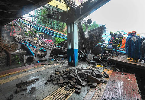 Rescue workers clear the debris of Gokhale foot overbridge that collapsed on the Western Railway tracks at Andheri station following heavy rain in Mumbai on Tuesday July 03 2018. (File Photo | PTI)