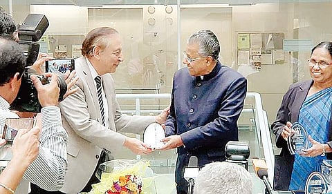 Institute of Human Virology co-founder Dr Robert C Gallo presents awards to Chief Minister Pinarayi Vijayan and Health Minister K K Shylaja in Baltimore