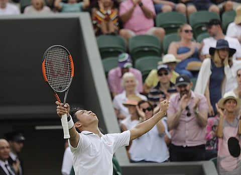 Kei Nishikori of Japan celebrates defeating Ernests Gulbis of Latvia in their men's singles match on the seventh day at the Wimbledon Tennis Championships in London. (AP)