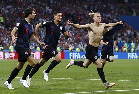 Croatia's Domagoj Vida, right, celebrates with his teammates after scoring his side's second goal during the quarterfinal match between Russia and Croatia at the 2018 FIFA World Cup. | AP