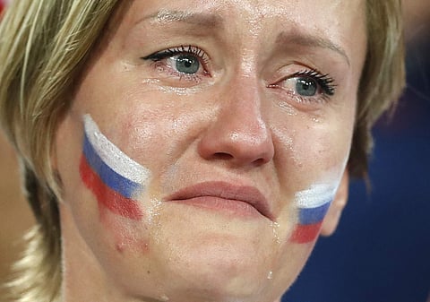 A Russia's fan cries after the home side's loss in the quarterfinal match against Croatia | AP