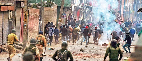 Police and CRPF personnel chase stone pelters during a protest in Srinagar  (File Photo | PTI)