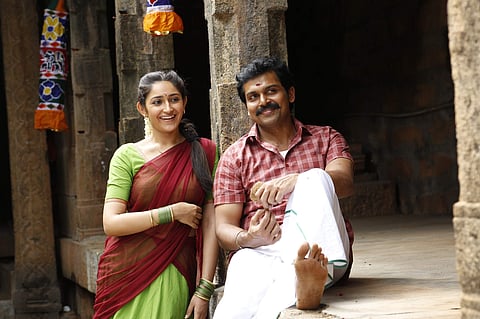 Sayyeshaa and Karthi in a still of 'Kadai Kutty Singam'.