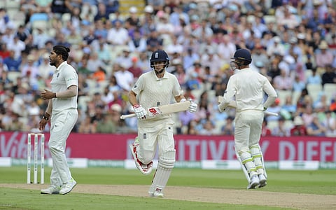 England's Joe Root and Keaton Jennings run between the wickets as India's Umesh Yadav waits for the ball during the first day of the first test match | AP