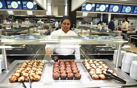 A woman employee selling cupcakes and muffins at a store inside IKEA, Hyderabad. IKEA has planned a variety of dishes at its Hyderabad outlet, including local delicacies like veg and non-veg Biriyani.   (Photo | AFP)