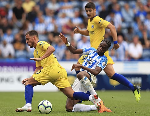 Chelsea's Eden Hazard, left, and Huddersfield Town's Terence Kongolo during their English Premier League soccer match at the John Smith's Stadium in Huddersfield, England, Saturday Aug. 11, 2018.  | AP