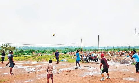 Due to lack of a proper ground, Jagathgirigutta youths play at an open land which is used as a dumpyard. The site is also infested with mosquitoes and pigs |Express