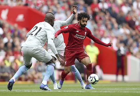 Liverpool's Mohamed Salah, right, dribbles the ball during their Premier League match against West Ham at Anfield, Liverpool. (Photo | AP)