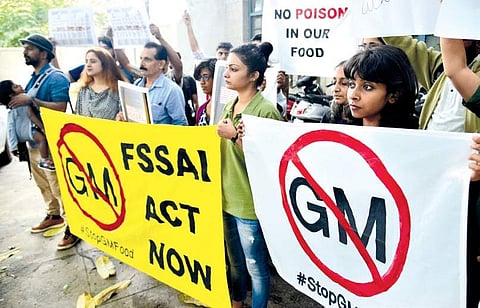 Protesting activists demand removal of genetically modified food products from markets outside the FSSAI office in Bengaluru on Monday | Pushkar V