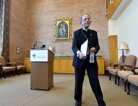 Erie Catholic Bishop Lawrence T. Persico reads a statement during a news conference at the St. Mark Catholic Center in Erie on Tuesday, Aug. 14, 2018. In responding to the state Attorney General's grand jury report on sex abuses in the Catholic Diocese of