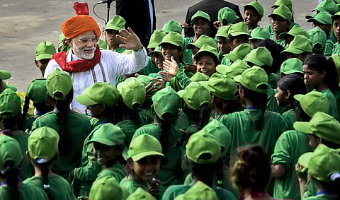 PM Narendra Modi greets children after delivering his Independence Day address. | PTI