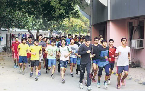 Wrestlers during a practise session at the Chhatrasal Stadium in New Delhi.