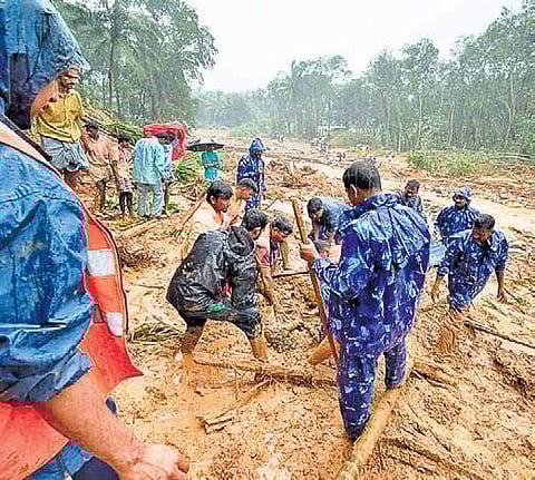 CRPF, police and fire force personnel searching for a child on Friday in the landslide debris at Kottopadam