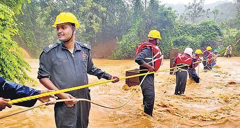 NDRF personnel rescuing people