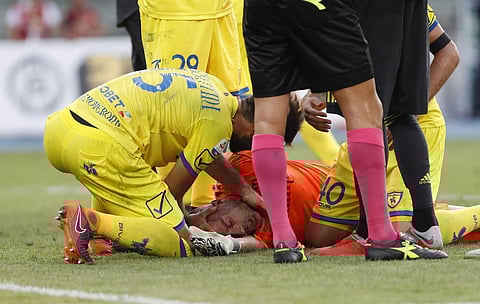 Chievo goalkeeper Stefano Sorrentino gets assistance after the collision | AP