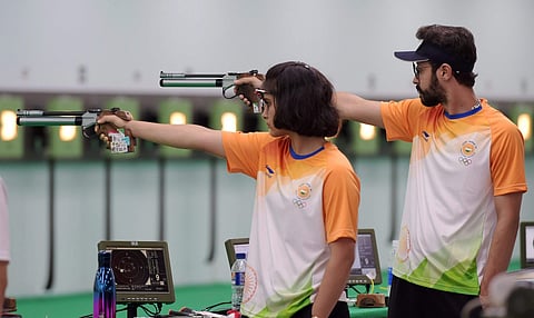 Indian shooters Abhishek Verma and Manu Bhaker compete in the 10m air pistal qualification round during the 18th Asian Games Jakarta Palembang in Indonesia on Sunday Aug 19 2018. (Photo | PTI)
