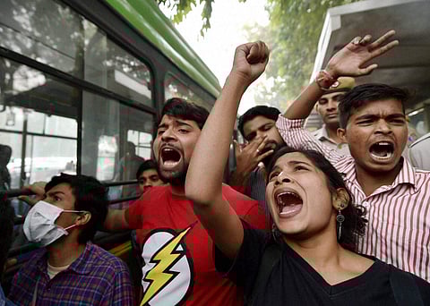Members of AISA and JNUSU shouting slogans during their protest in New Delhi on Sunday. (File Photo| PTI)