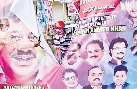 BBMP officials removing banners at Queen’s Road in Bengaluru on Wednesday | Pandarinath B