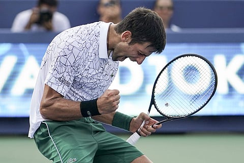 Novak Djokovic, of Serbia, reacts after defeating Roger Federer, of Switzerland, during the finals at the Western & Southern Open tennis tournament. (Photo | AP)