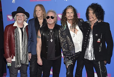 Brad Whitford, from left, Tom Hamilton, Joey Kramer, Steven Tyler and Joe Perry of Aerosmith arrive at the MTV Video Music Awards at Radio City Music Hall on Monday, Aug. 20, 2018, in New York. | AP