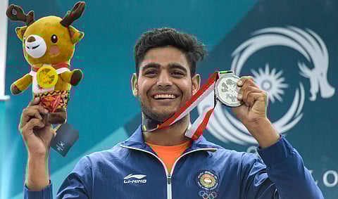 Silver medallist India's Lakshay Sheoran poses for photographs at the award ceremony of men's trap shooting event during the 18th Asian Games 2018 at Palembang in Indonesia. (Photo | PTI)