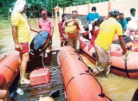 Odisha fire service personnel rescuing stranded people in Kerala on Monday | Express